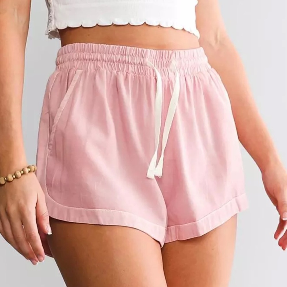 billabong road trippin elastic waist shorts in pink.